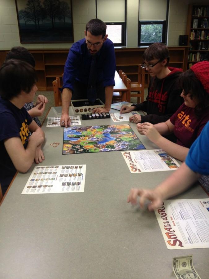 Mr. Johnston joins in on a game with the Strategy Club.