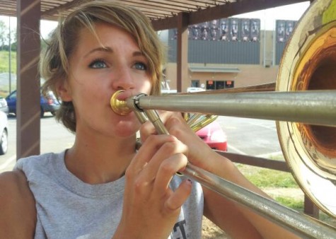 Jessie Wall (11) prepares to play her trombone.