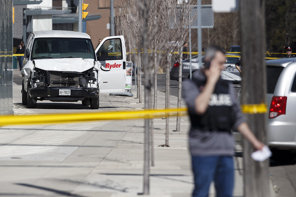 TORONTO, ON - APRIL 23: Police inspect a van suspected of being involved in a collision injuring at least eight people at Yonge St. and Finch Ave. on April 23, 2018 in Toronto, Canada. A suspect is in custody after a white van collided with multiple pedestrians. (Photo by Cole Burston/Getty Images)