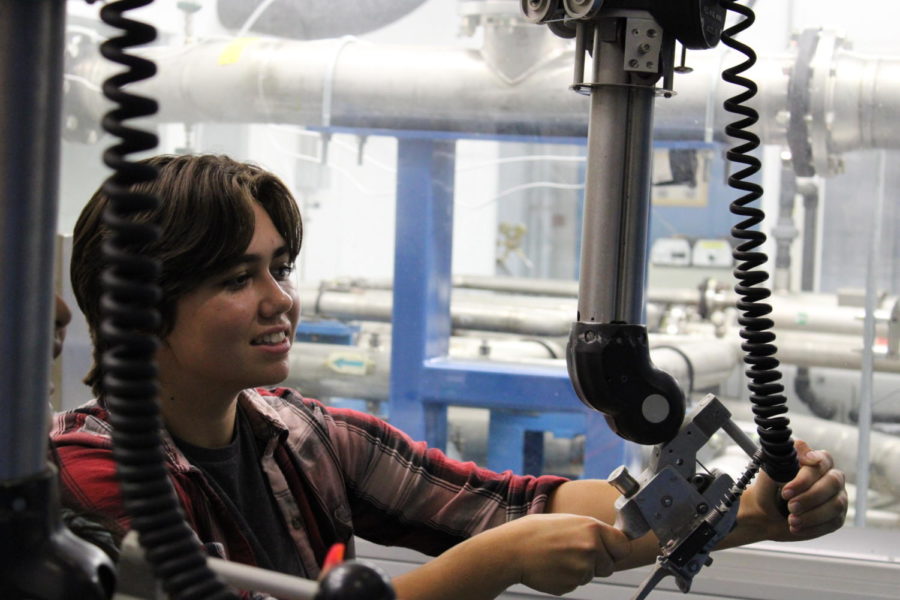 Amanda Matzek (12) uses the machinery at the Oak Ridge National Laboratory