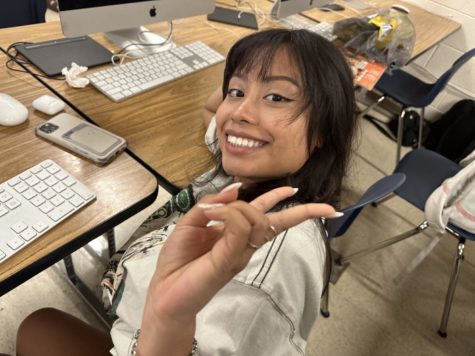 Naomi Huichapa (12) is working on the end of the year video.