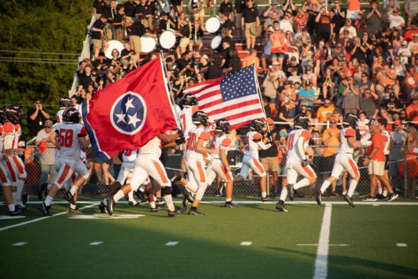 The Lenoir City Football team charge onto Loudons field for BOTB