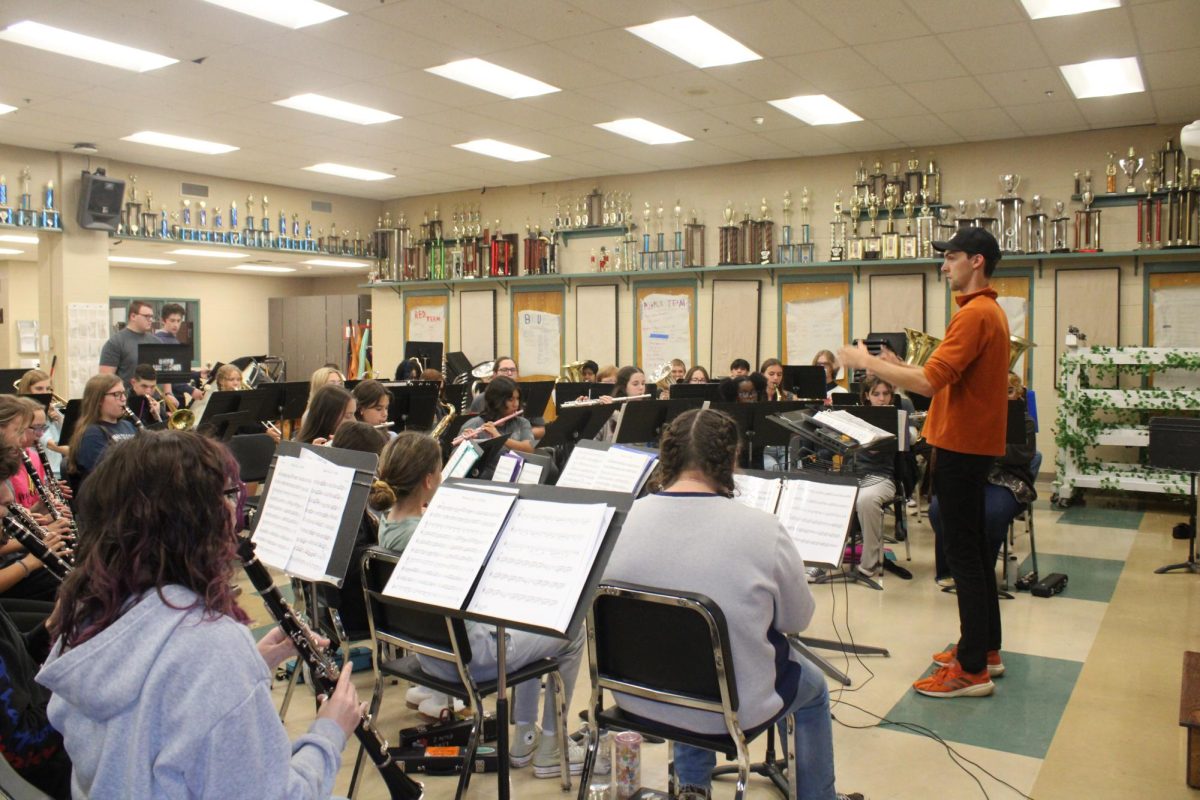 Mr. Slimp guiding his students in a rehearsal  
